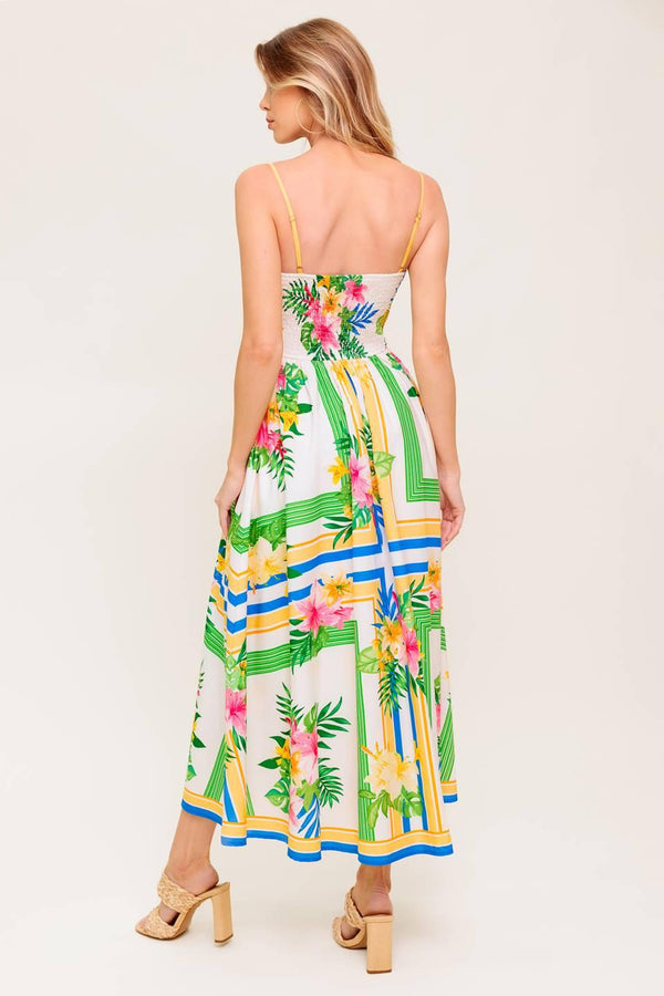 A printed woven midi dress featuring straight neckline, straps, full skirt and smocked back bodice.
