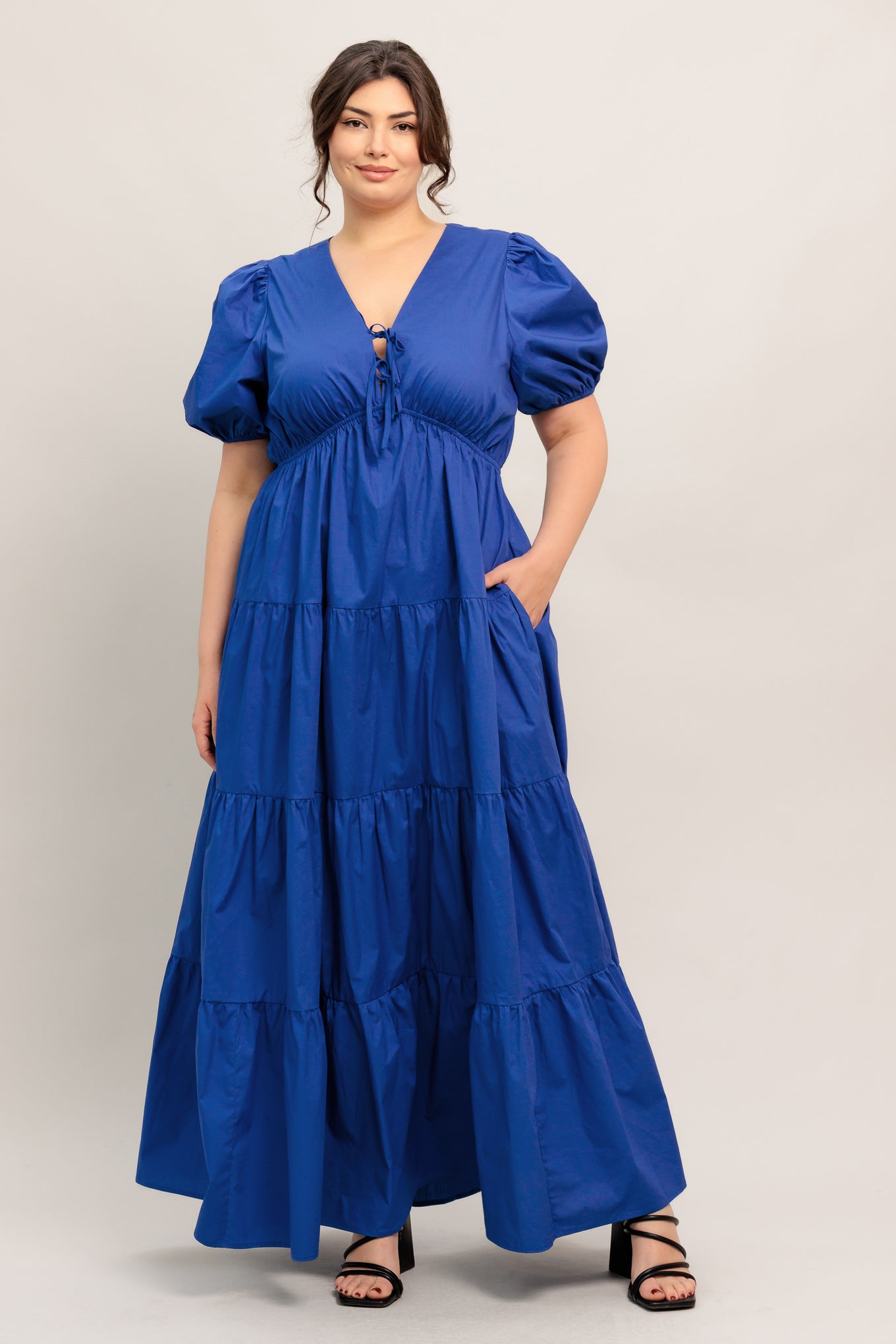 A solid royal blue woven maxi dress featuring V neckline with front bow closure, short puff sleeve, elasticized empire and tiered skirt.

Details:

Self : 100% Cotton

Size &amp; Fit

- Model is 5`8" And Wearing Size Small
- Measurements Taken From Size Small
- Approx. Length: 59" Flying Tomato