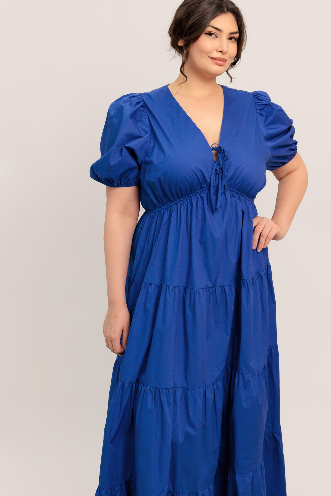 A solid royal blue woven maxi dress featuring V neckline with front bow closure, short puff sleeve, elasticized empire and tiered skirt.

Details:

Self : 100% Cotton

Size &amp; Fit

- Model is 5`8" And Wearing Size Small
- Measurements Taken From Size Small
- Approx. Length: 59" Flying Tomato