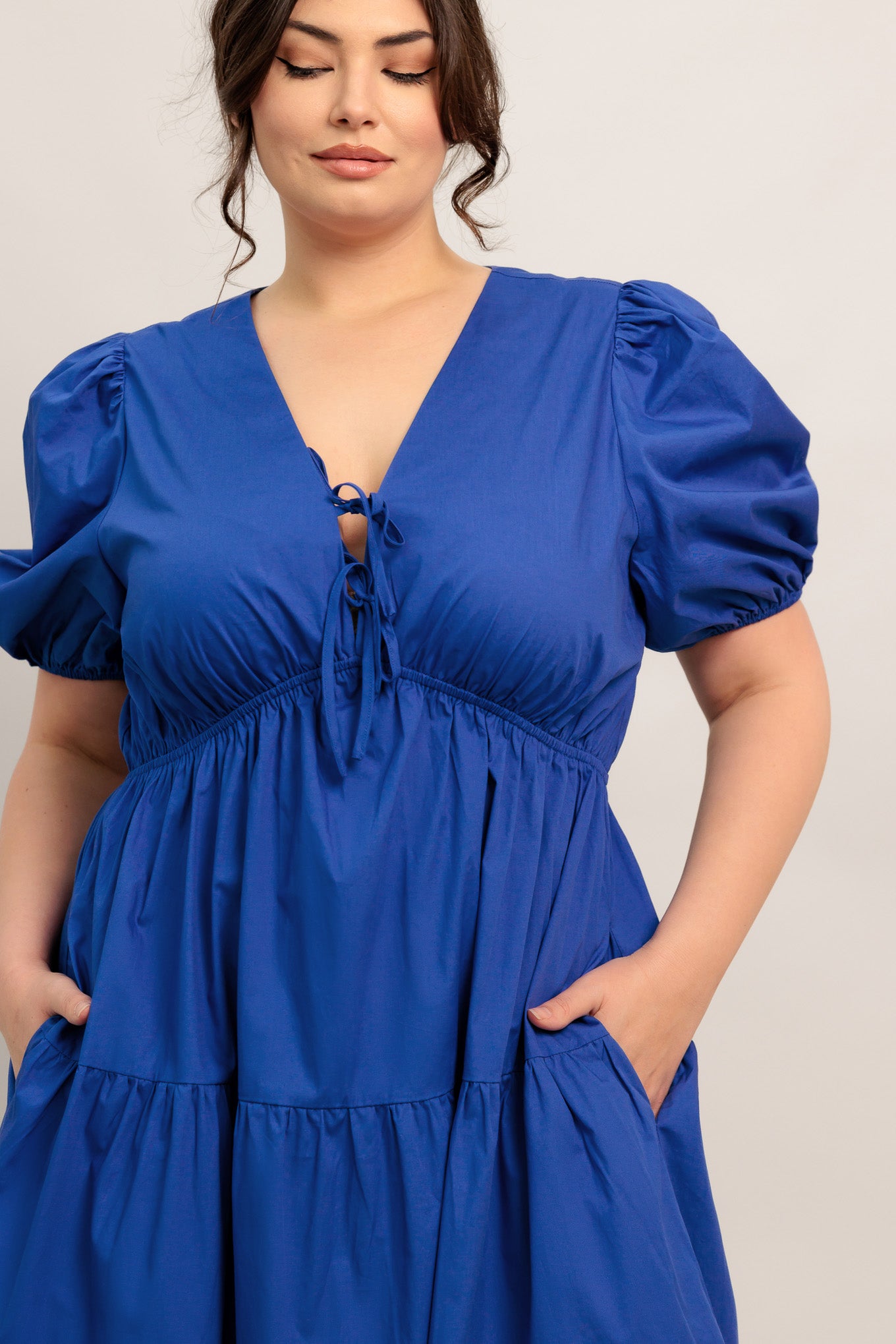A solid royal blue woven maxi dress featuring V neckline with front bow closure, short puff sleeve, elasticized empire and tiered skirt.

Details:

Self : 100% Cotton

Size &amp; Fit

- Model is 5`8" And Wearing Size Small
- Measurements Taken From Size Small
- Approx. Length: 59" Flying Tomato