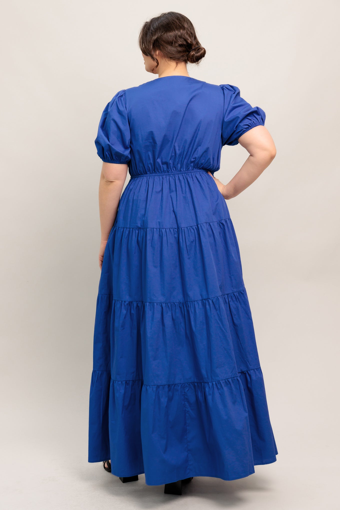 A solid royal blue woven maxi dress featuring V neckline with front bow closure, short puff sleeve, elasticized empire and tiered skirt.

Details:

Self : 100% Cotton

Size &amp; Fit

- Model is 5`8" And Wearing Size Small
- Measurements Taken From Size Small
- Approx. Length: 59" Flying Tomato
