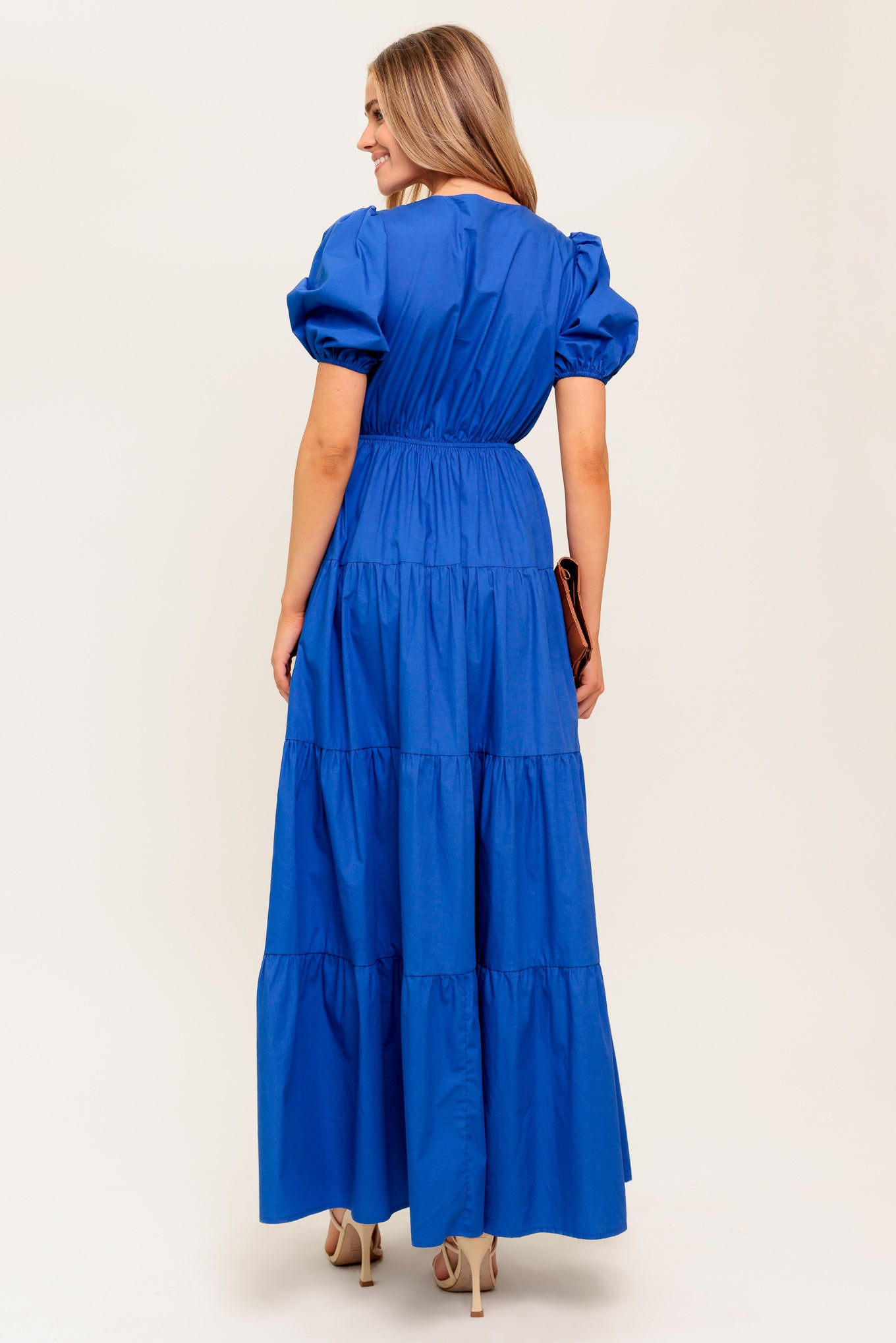 A solid royal blue woven maxi dress featuring V neckline with front bow closure, short puff sleeve, elasticized empire and tiered skirt.

Details:

Self : 100% Cotton

Size &amp; Fit

- Model is 5`8" And Wearing Size Small
- Measurements Taken From Size Small
- Approx. Length: 59" Flying Tomato