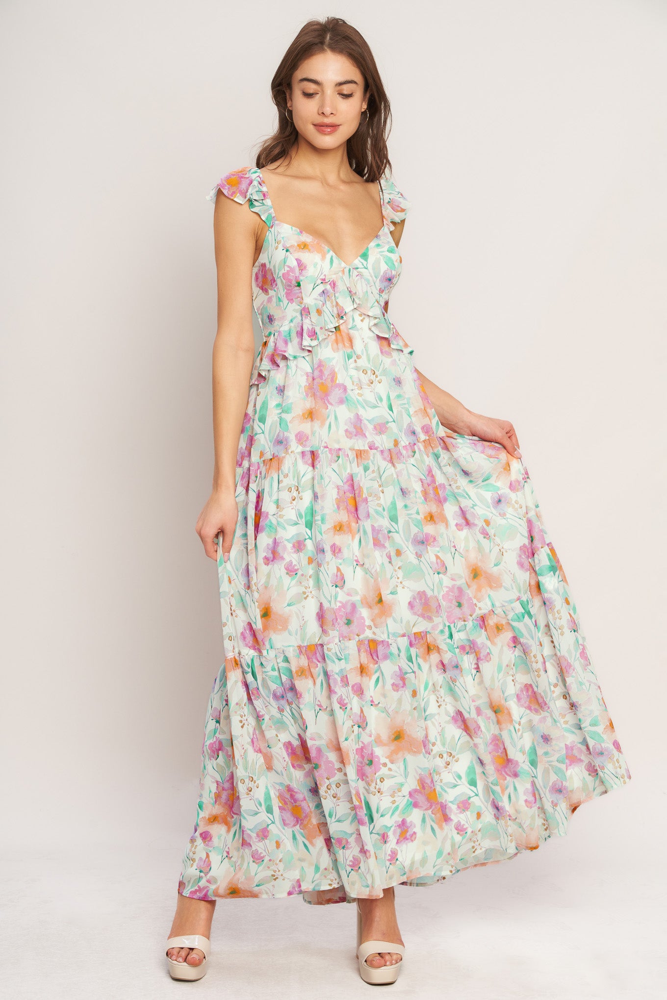 A printed woven maxi dress featuring sweetheart neckline, double ruffle sleeve, tiered skirt and smocked back bodice