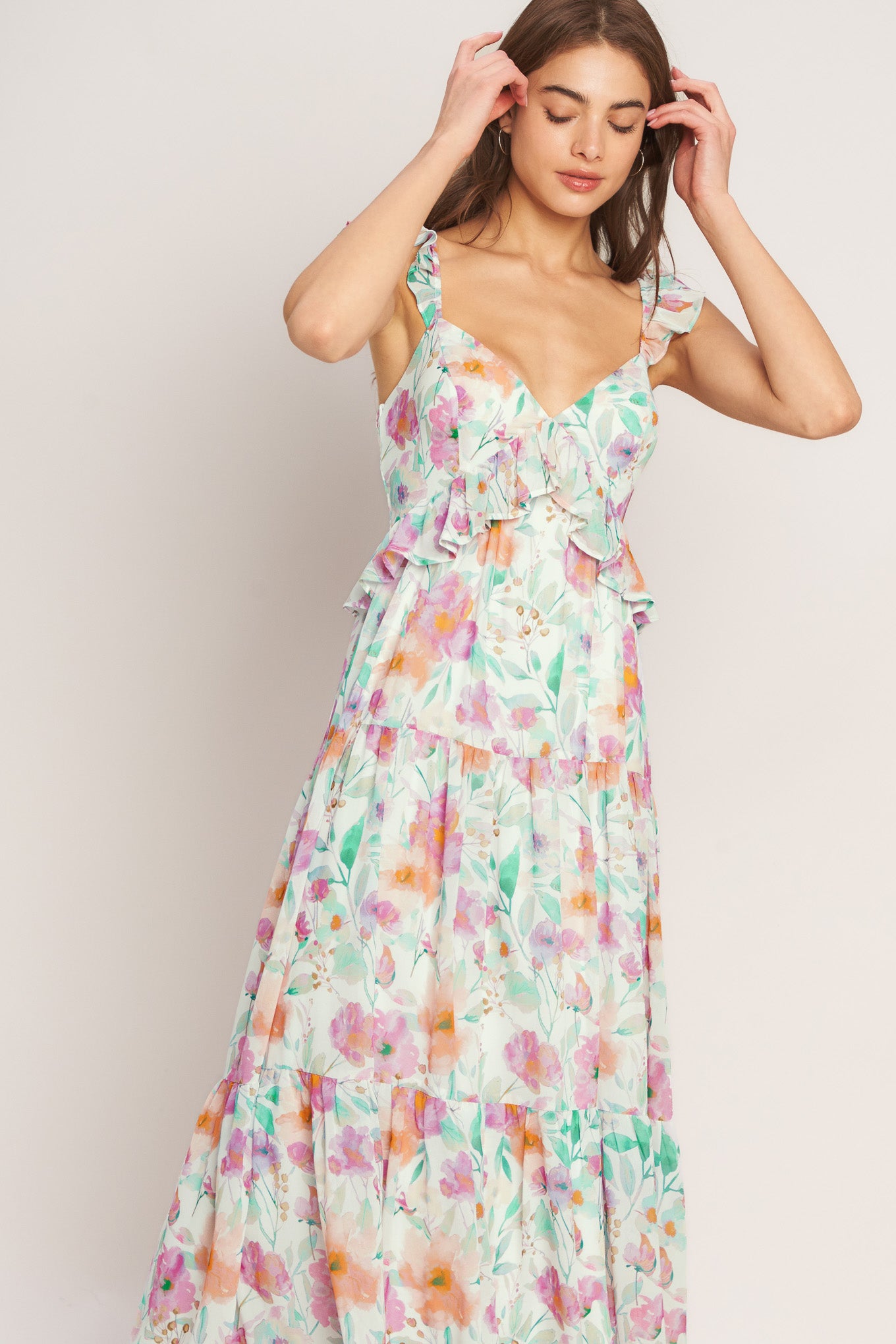 A printed woven maxi dress featuring sweetheart neckline, double ruffle sleeve, tiered skirt and smocked back bodice