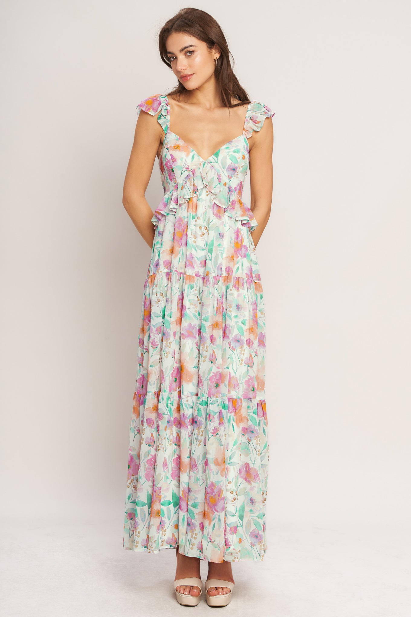 A printed woven maxi dress featuring sweetheart neckline, double ruffle sleeve, tiered skirt and smocked back bodice