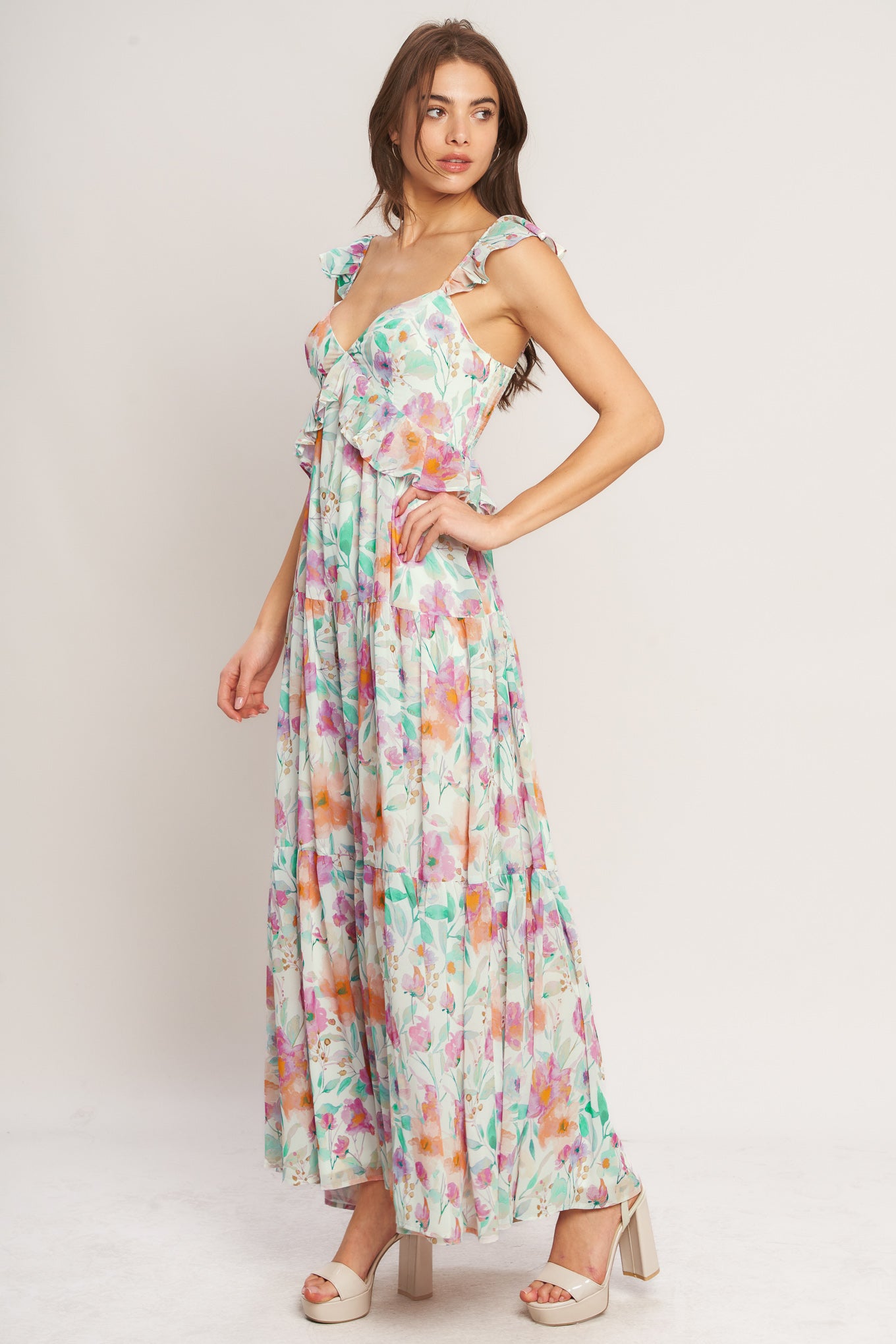 A printed woven maxi dress featuring sweetheart neckline, double ruffle sleeve, tiered skirt and smocked back bodice