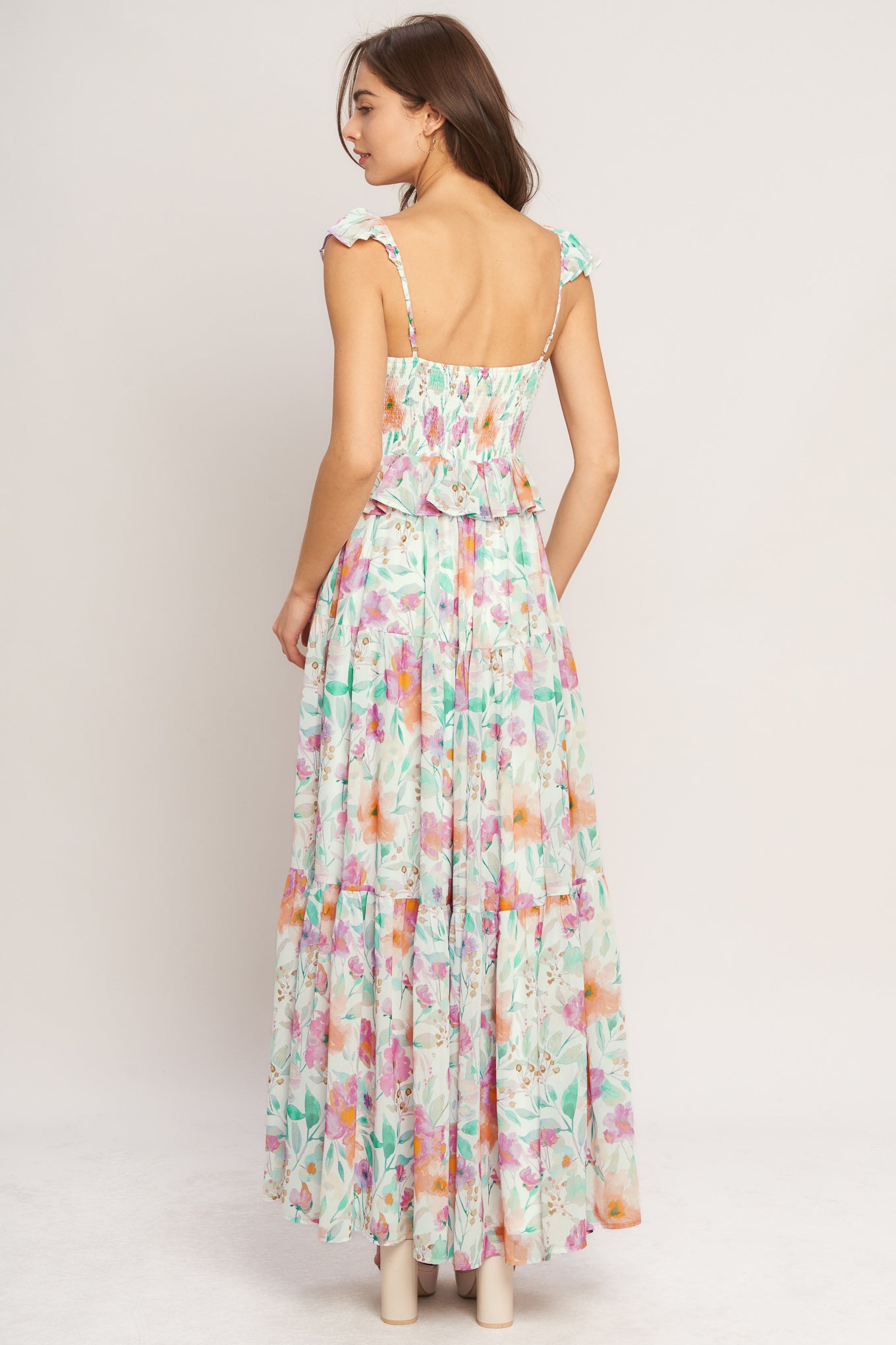 A printed woven maxi dress featuring sweetheart neckline, double ruffle sleeve, tiered skirt and smocked back bodice