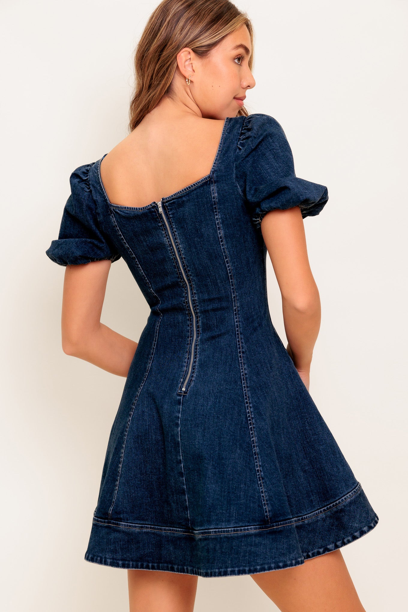 
A washed denim mini dress featuring square neckline, short puff sleeve, circle skirt and back zipper closure

Details:

Self : 98% Cotton 2% Spandex

Size &amp; Fit

- Model is 5`8" And Wearing Size Small
- Measurements Taken From Size Small
- Approx. Length: 35" FLYING TOMATO