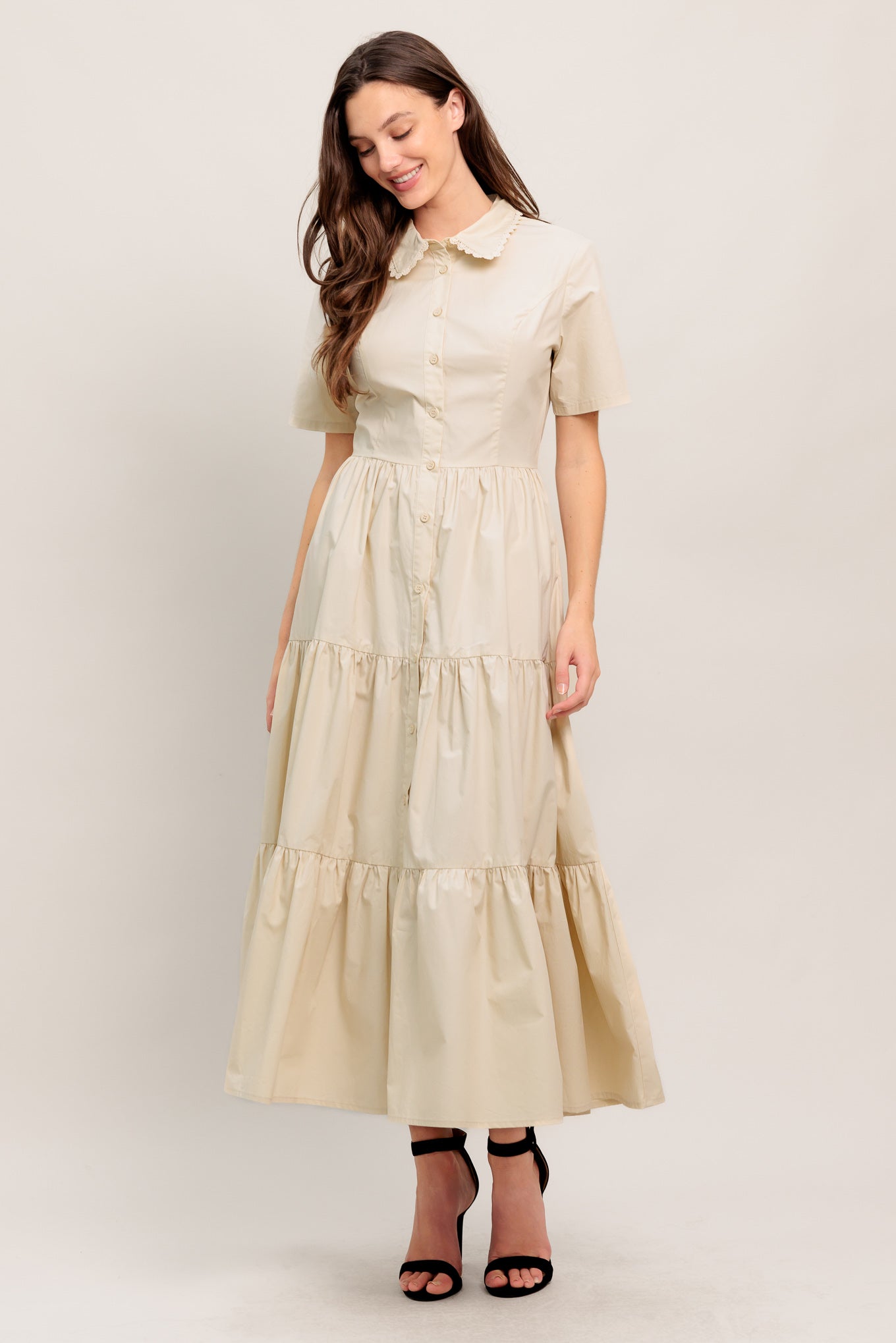
A solid woven midi dress featuring collar with lace trim, short sleeve, front button down closure, self sash tie and tiered skirt

Details:

Self : 100% Cotton Exclusive of Decoration

Size &amp; Fit

- Model is 5`8" And Wearing Size Small
- Measurements Taken From Size Small
- Approx. Length: 52" FLYING TOMATO