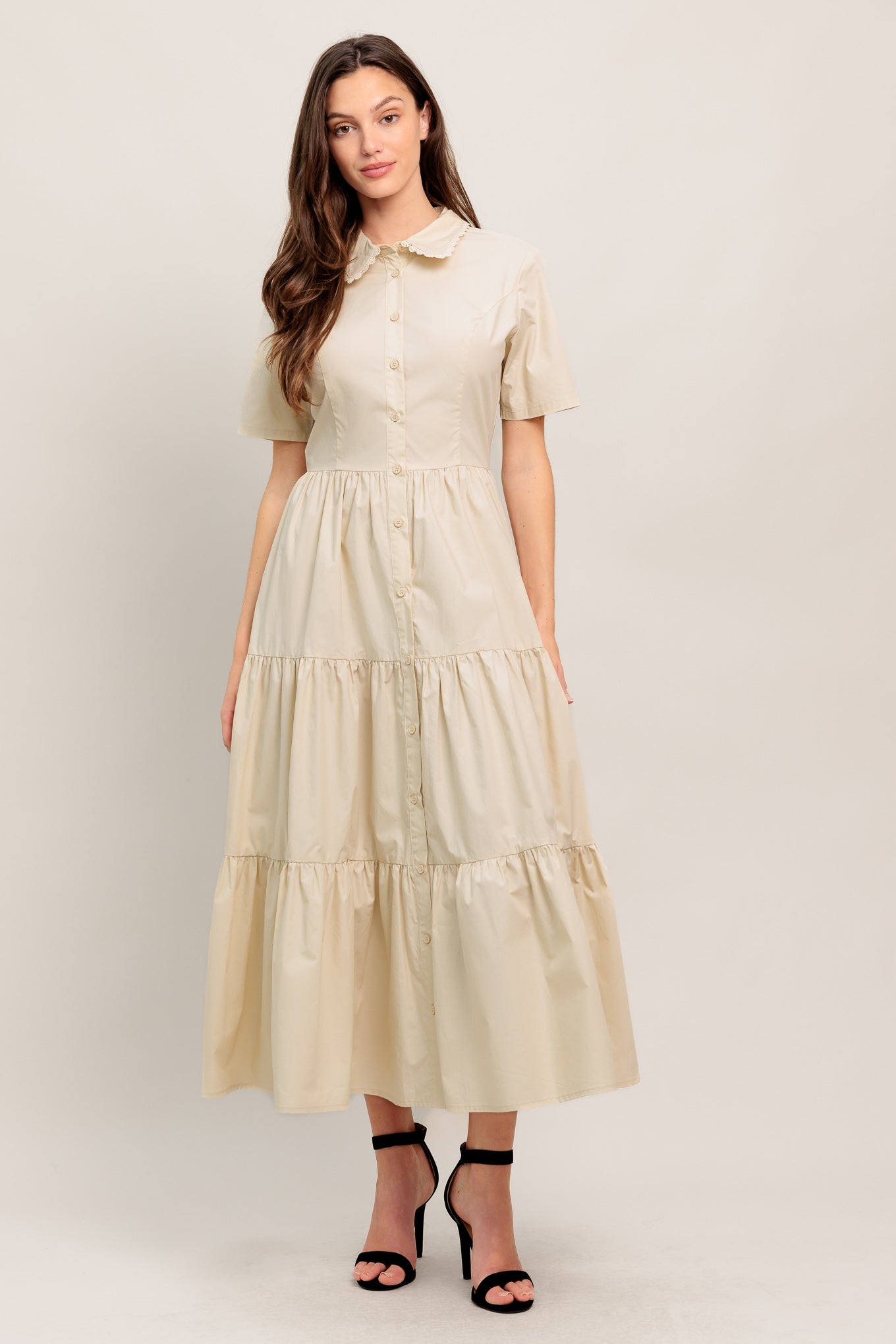 
A solid woven midi dress featuring collar with lace trim, short sleeve, front button down closure, self sash tie and tiered skirt

Details:

Self : 100% Cotton Exclusive of Decoration

Size &amp; Fit

- Model is 5`8" And Wearing Size Small
- Measurements Taken From Size Small
- Approx. Length: 52" FLYING TOMATO