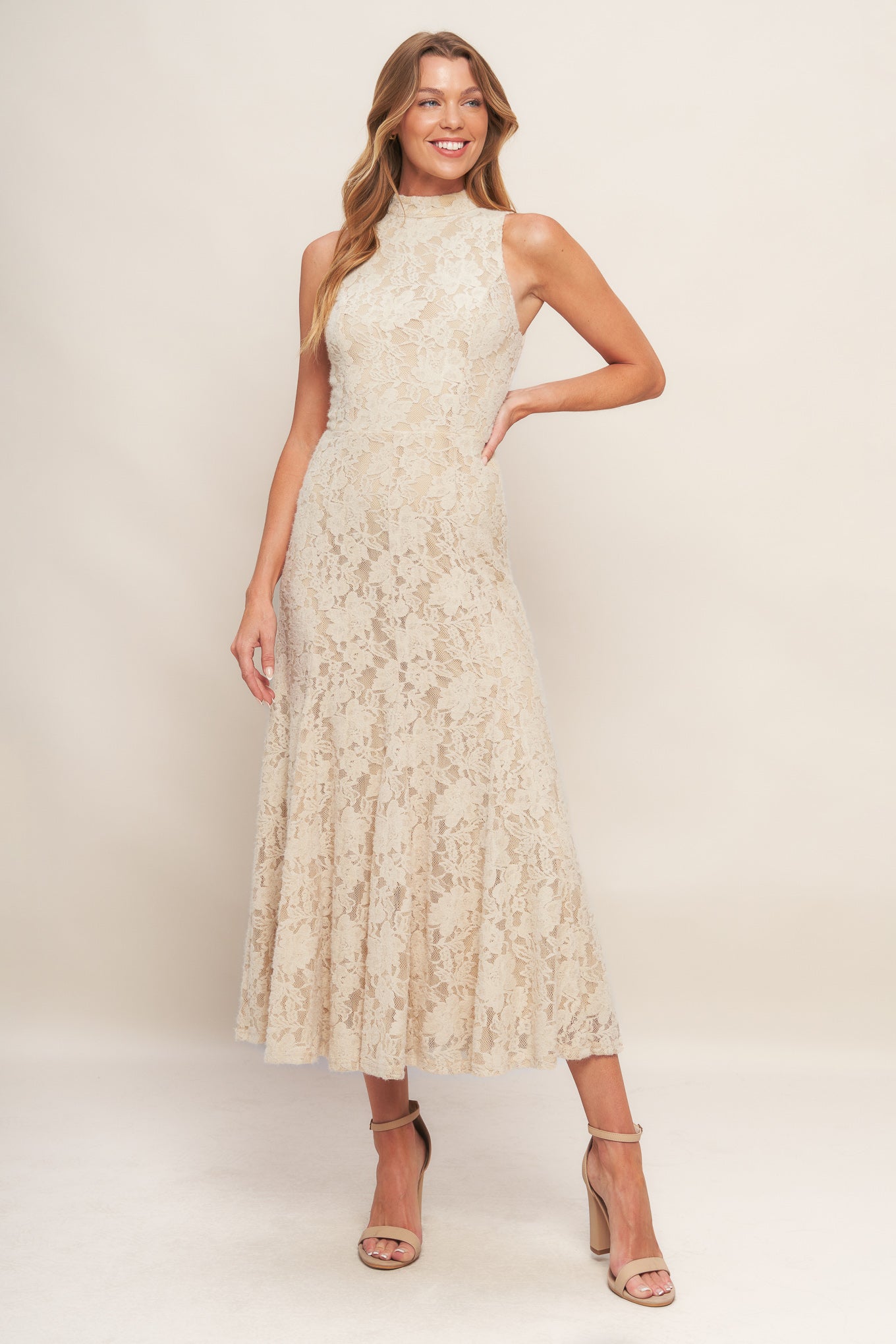 A stretch lace midi dress featuring mock neckline, sleeveless and back zipper closure