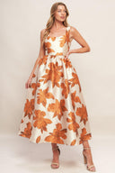 A printed woven midi dress featuring U neckline, sleeveless, full skirt and back zipper closure