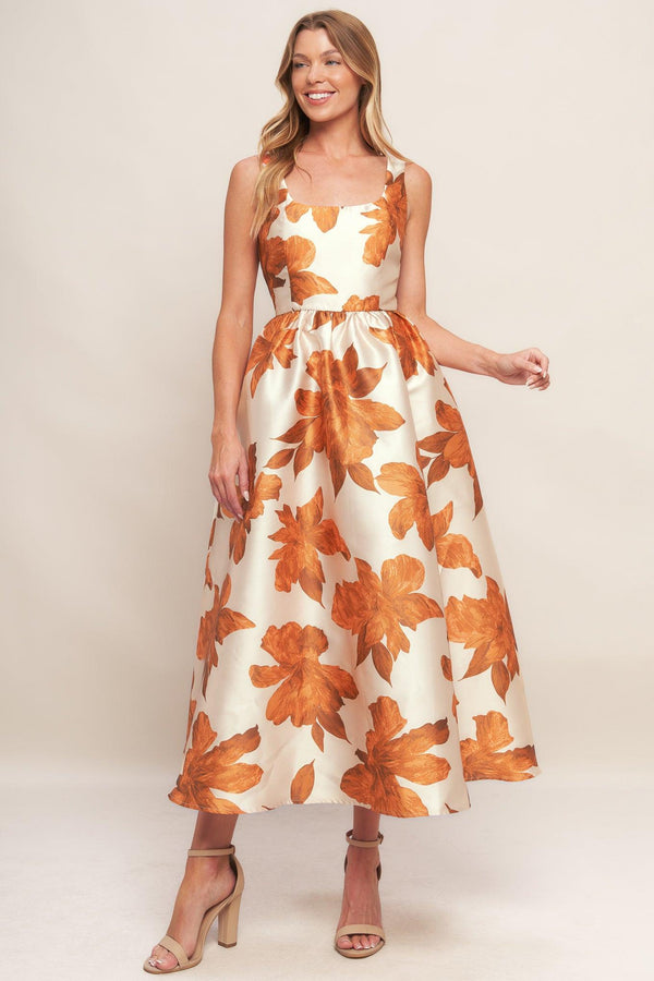 A printed woven midi dress featuring U neckline, sleeveless, full skirt and back zipper closure