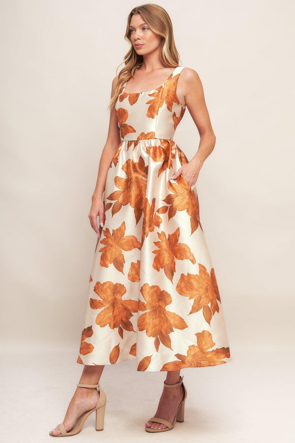 A printed woven midi dress featuring U neckline, sleeveless, full skirt and back zipper closure
