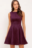Woman wearing a plum burgundy suede mini dress | Flying Tomato
