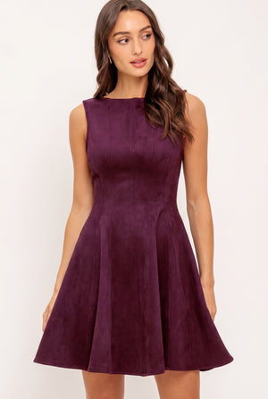 Woman wearing a plum burgundy suede mini dress | Flying Tomato