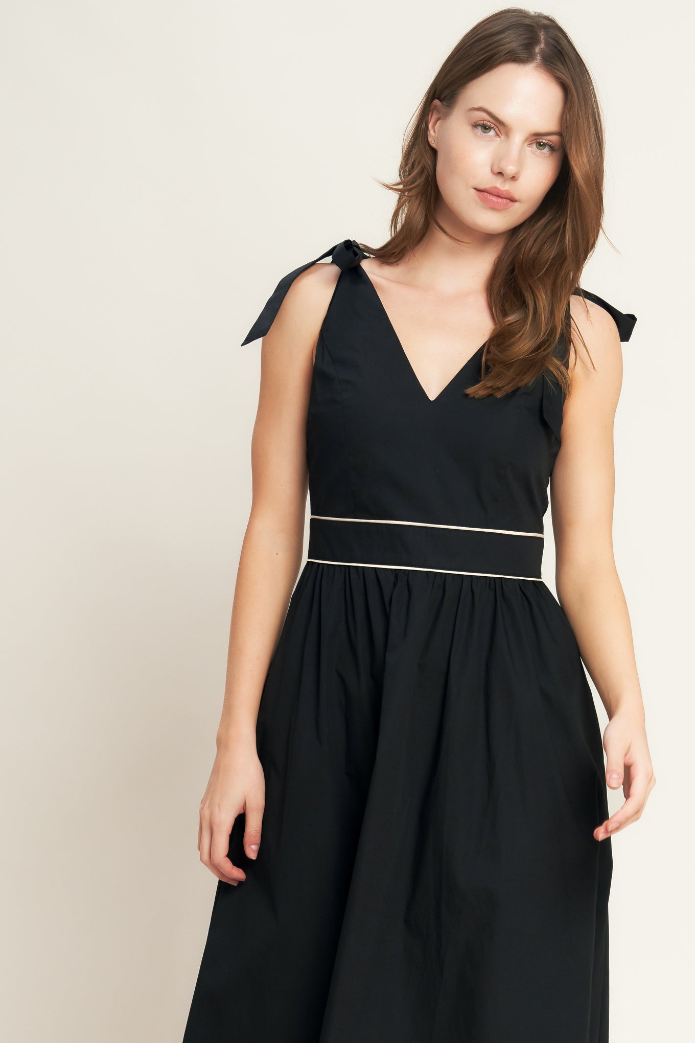 A solid woven color blocked midi dress featuring V neckline, shoulder tie, sleeveless, full skirt and back zipper closure

Details:

Self : 100% Cotton
Contrast : 100% Cotton
Lining : 100% Polyester

Size &amp; Fit

- Model is 5`8" And Wearing Size Small
- Measurements Taken From Size Small
- Approx. Length: 52" Flying Tomato