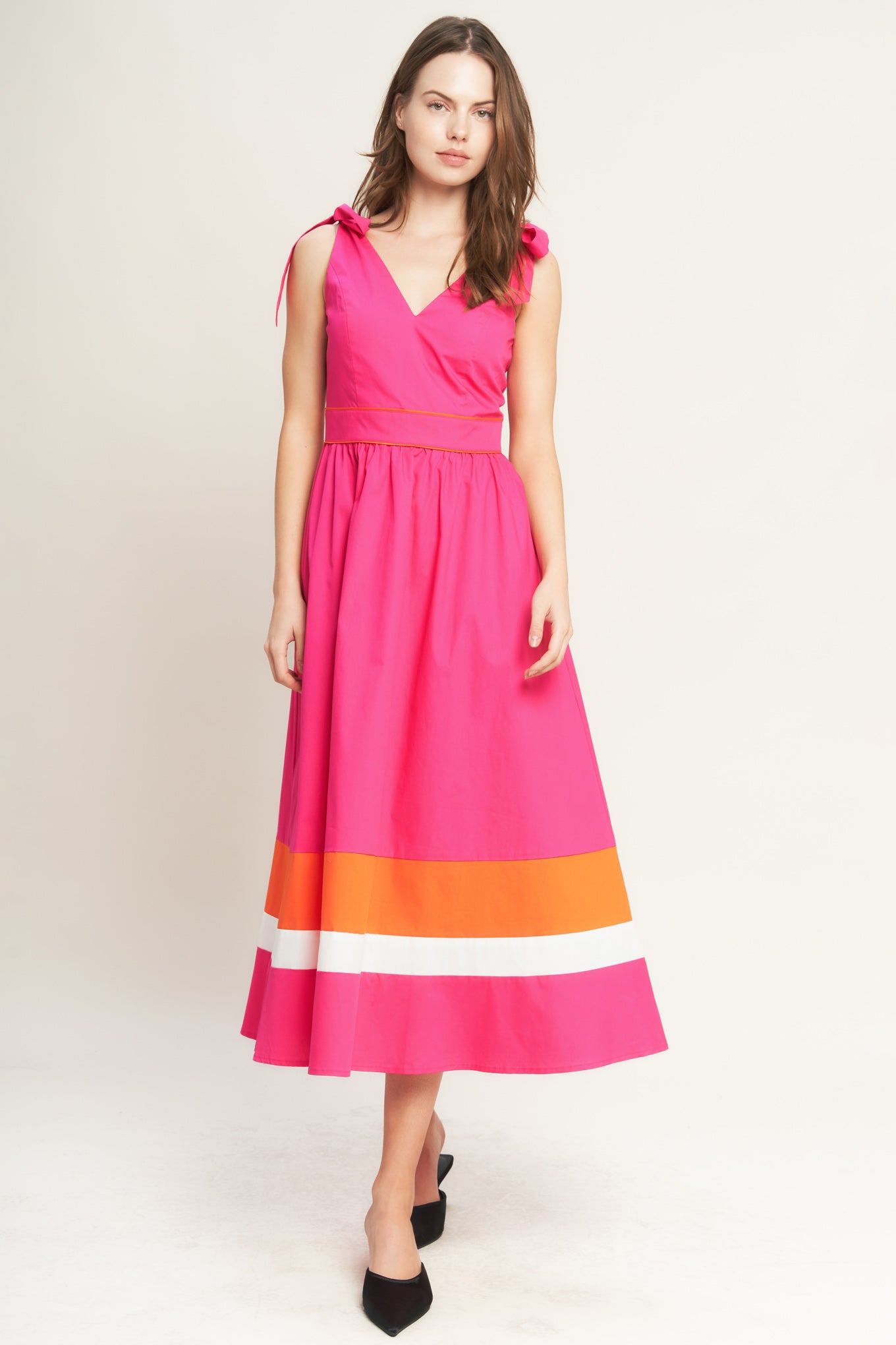 A solid woven color blocked midi dress featuring V neckline, shoulder tie, sleeveless, full skirt and back zipper closure

Details:

Self : 100% Cotton
Contrast : 100% Cotton
Lining : 100% Polyester

Size &amp; Fit

- Model is 5`8" And Wearing Size Small
- Measurements Taken From Size Small
- Approx. Length: 52" Flying Tomato