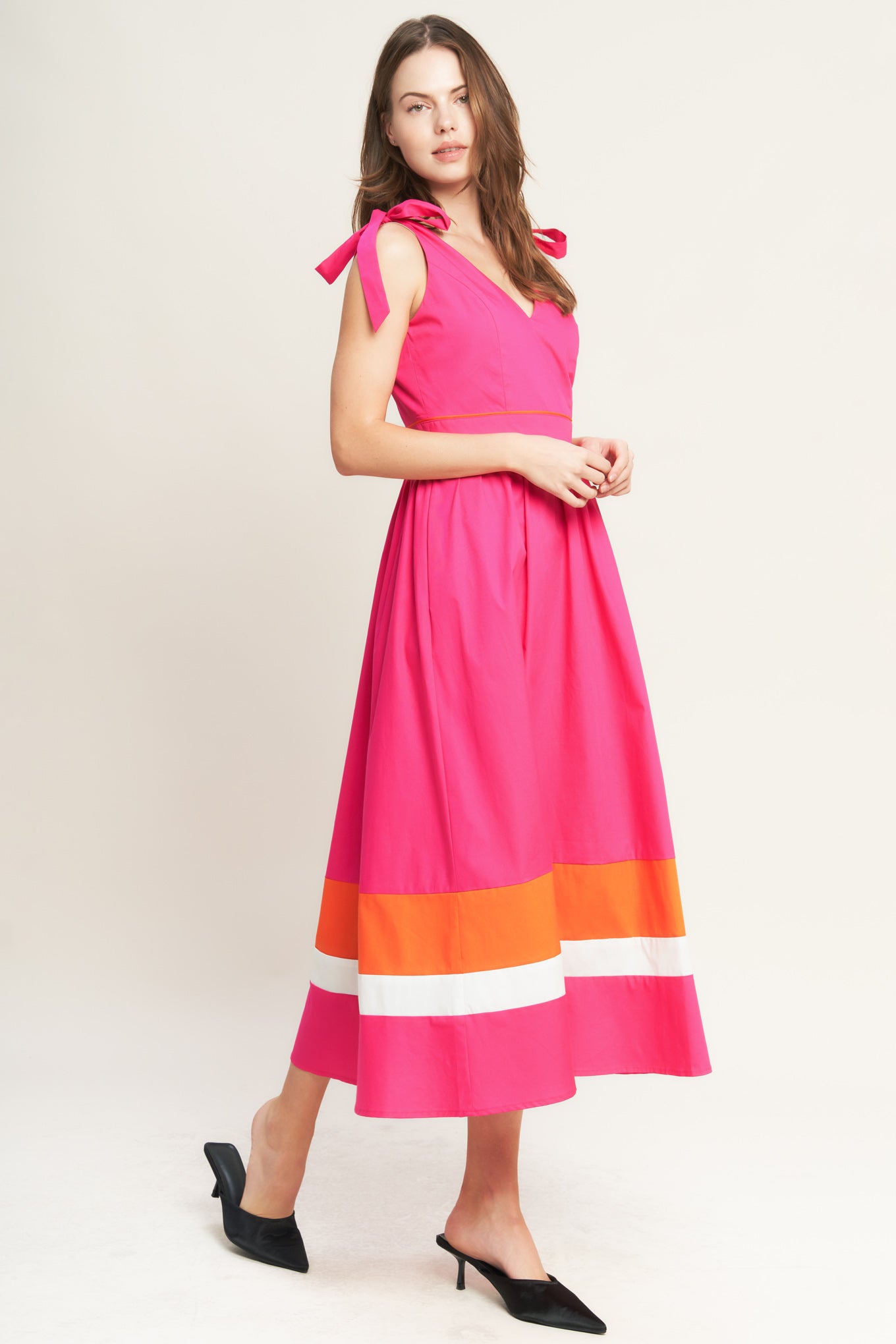 A solid woven color blocked midi dress featuring V neckline, shoulder tie, sleeveless, full skirt and back zipper closure

Details:

Self : 100% Cotton
Contrast : 100% Cotton
Lining : 100% Polyester

Size &amp; Fit

- Model is 5`8" And Wearing Size Small
- Measurements Taken From Size Small
- Approx. Length: 52" Flying Tomato