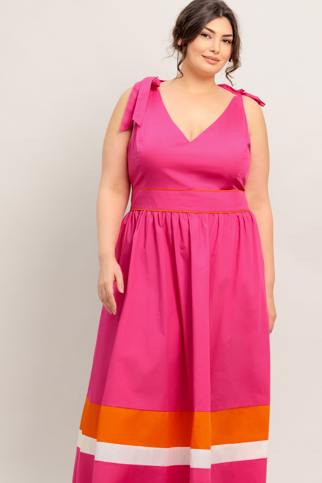 A solid woven color blocked midi dress featuring V neckline, shoulder tie, sleeveless, full skirt and back zipper closure

Details:

Self : 100% Cotton
Contrast : 100% Cotton
Lining : 100% Polyester

Size &amp; Fit

- Model is 5`8" And Wearing Size Small
- Measurements Taken From Size Small
- Approx. Length: 52" Flying Tomato