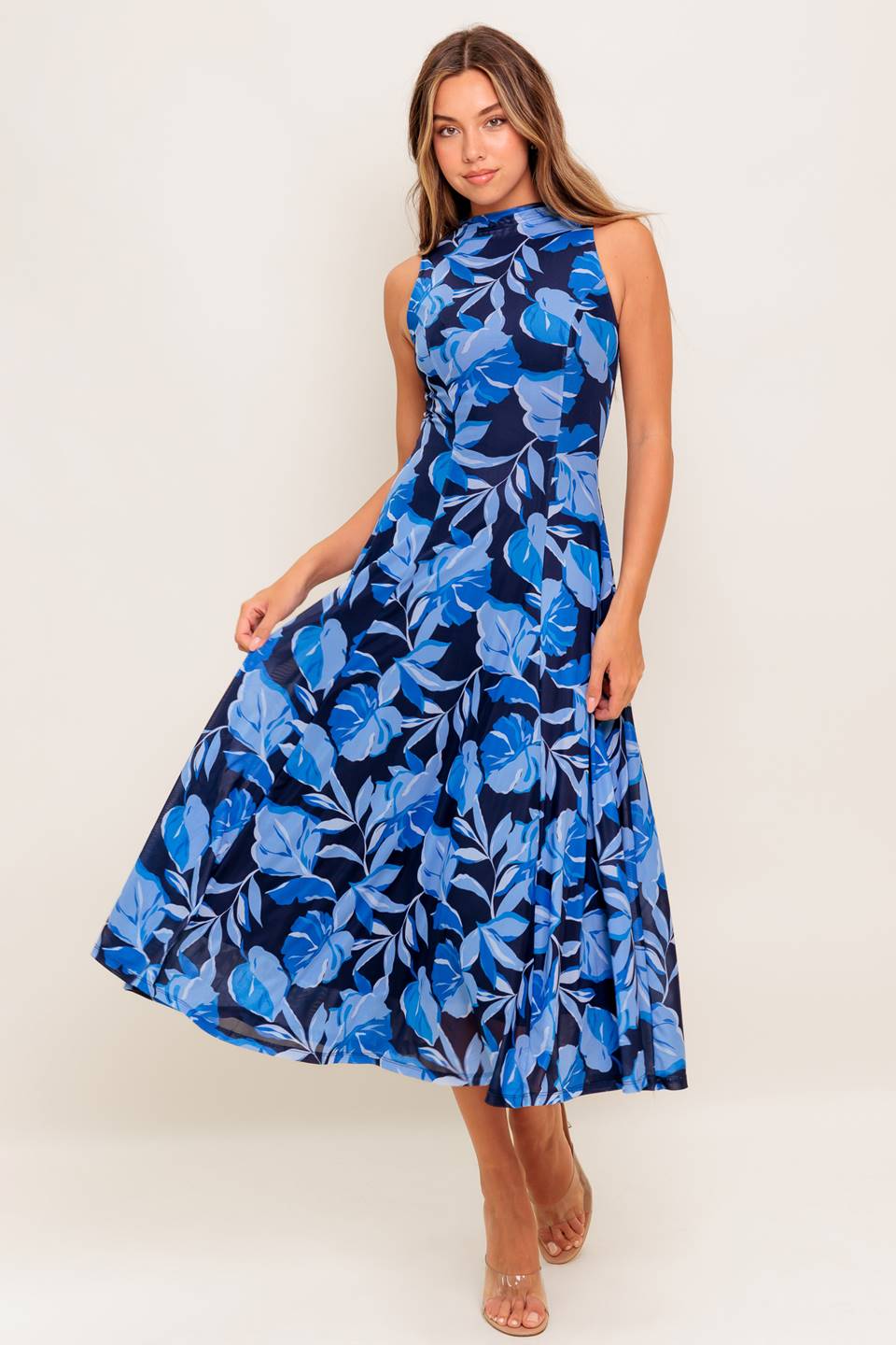 A printed power mesh midi dress featuring high neckline, sleeveless and circle skirt