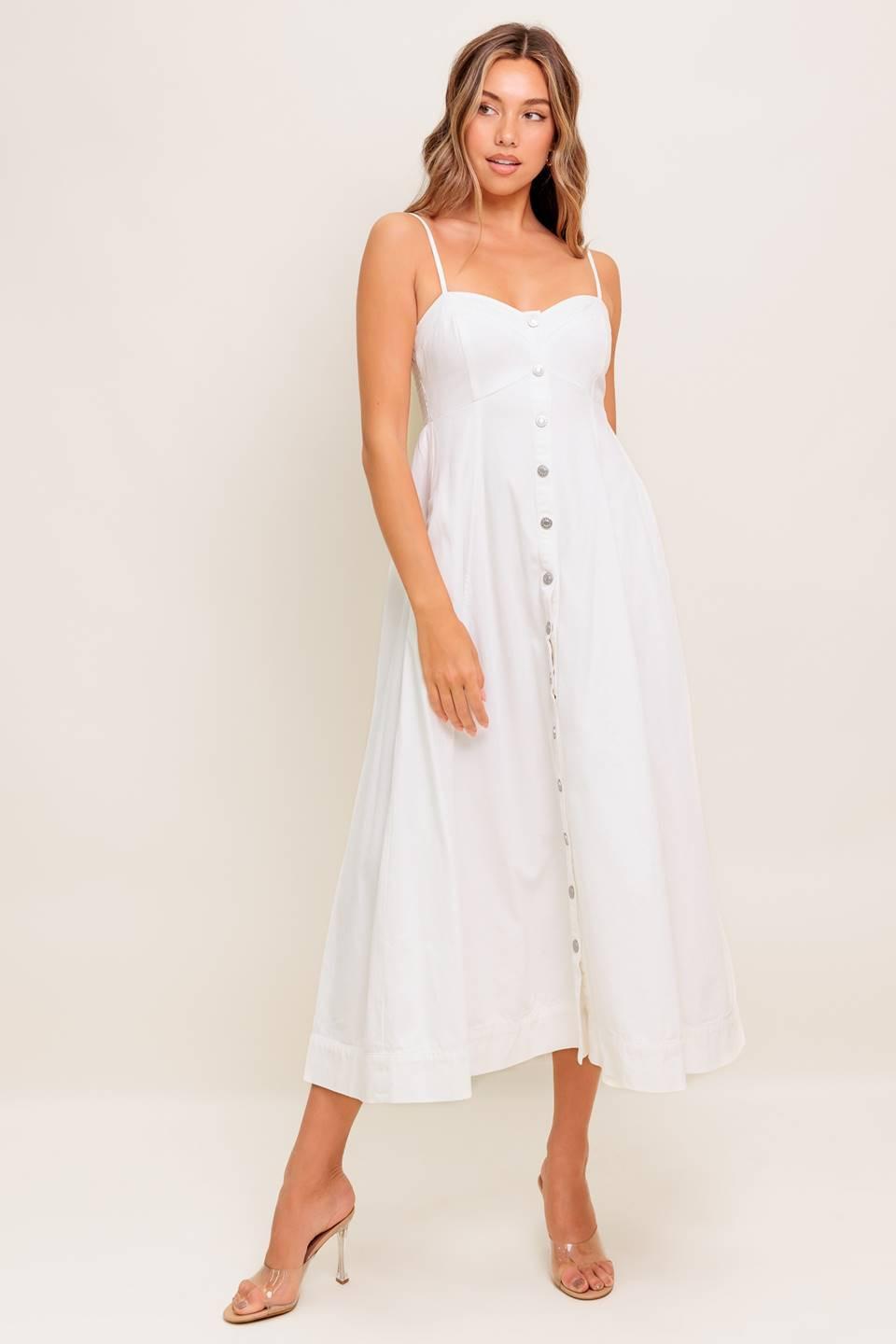 A solid woven midi dress featuring cami top, straps, front button down, full skirt and smocked back bodice