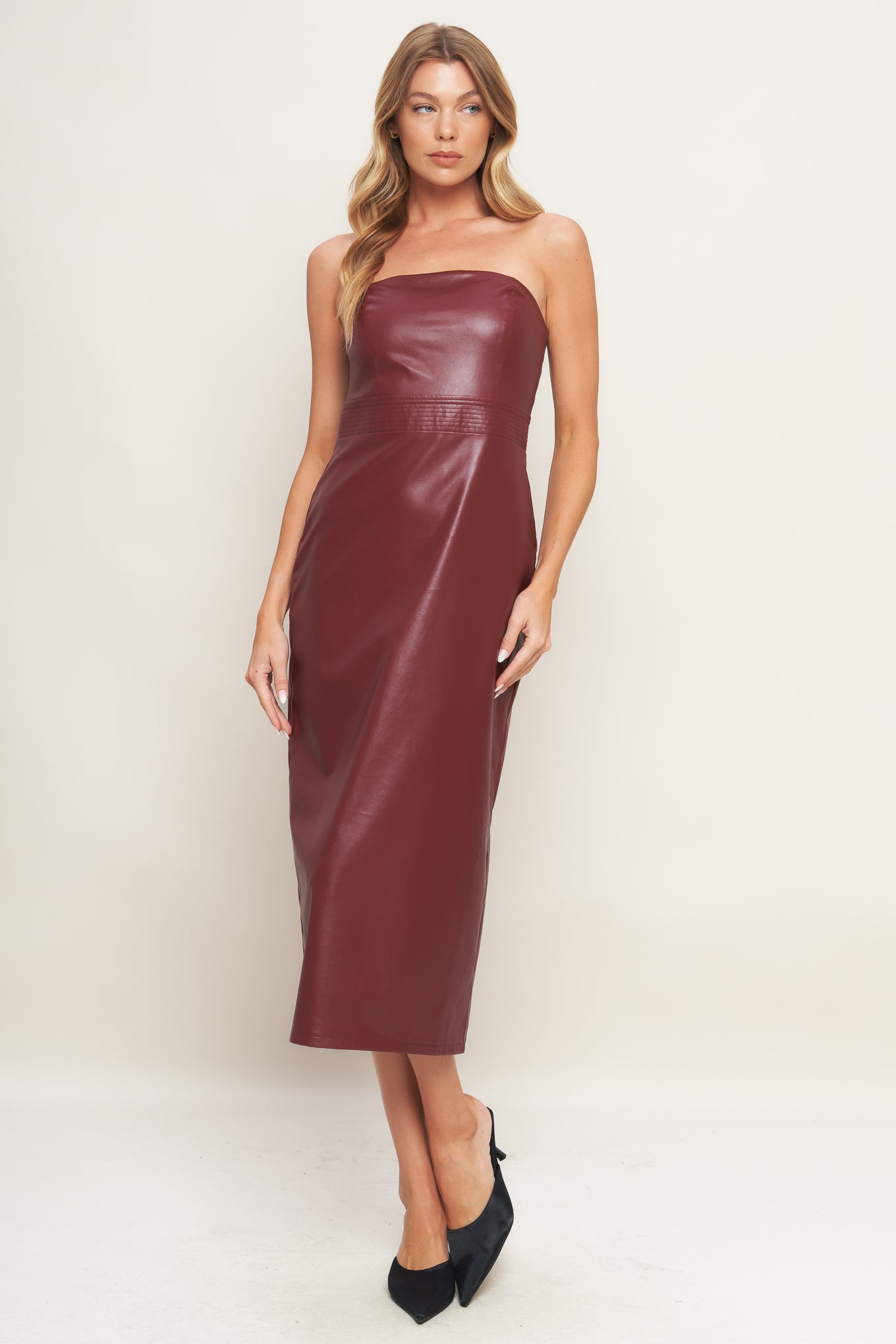 A faux leather midi dress featuring wide neckline, sleeveless, pencil skirt, back slit and back zipper closure