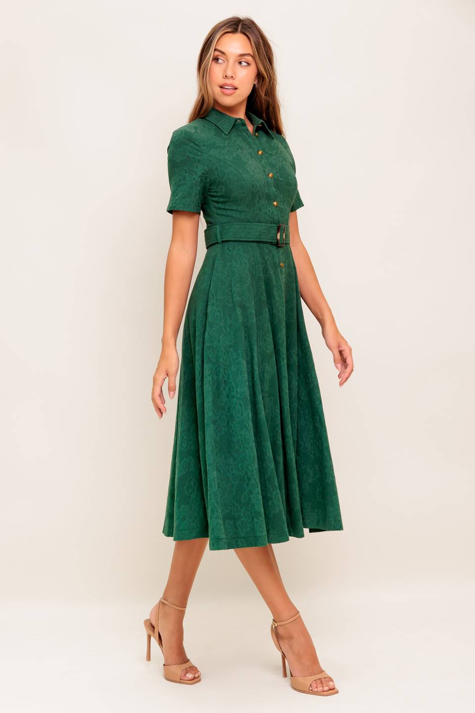 A jacquard woven midi dress featuring collar, short sleeve, button down, self belt, side pocket and full skirt