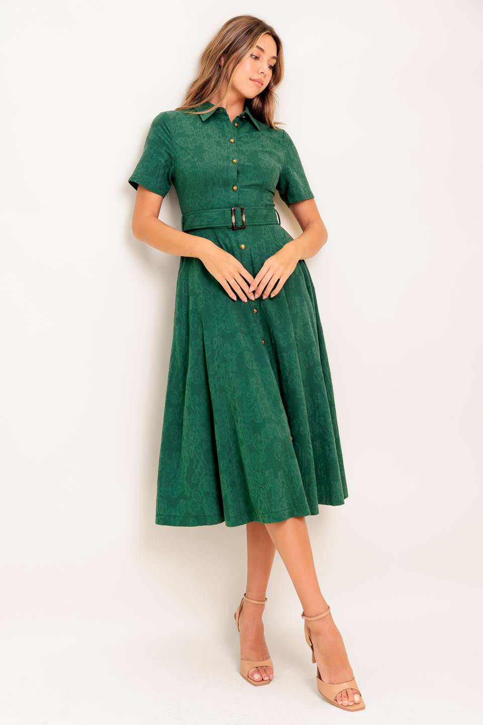 A jacquard woven midi dress featuring collar, short sleeve, button down, self belt, side pocket and full skirt