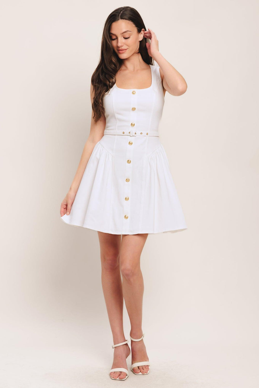 A solid woven mini dress featuring square neckline, sleeveless, front button down detail, self belt, side shirred full skirt and back zipper closure

Details:

Self: 97% Cotton 3% Spandex

Size & Fit

-Model is 5`8" And Wearing Size Small
-Measurements Taken From Size Small
-Approx. Length: 34"