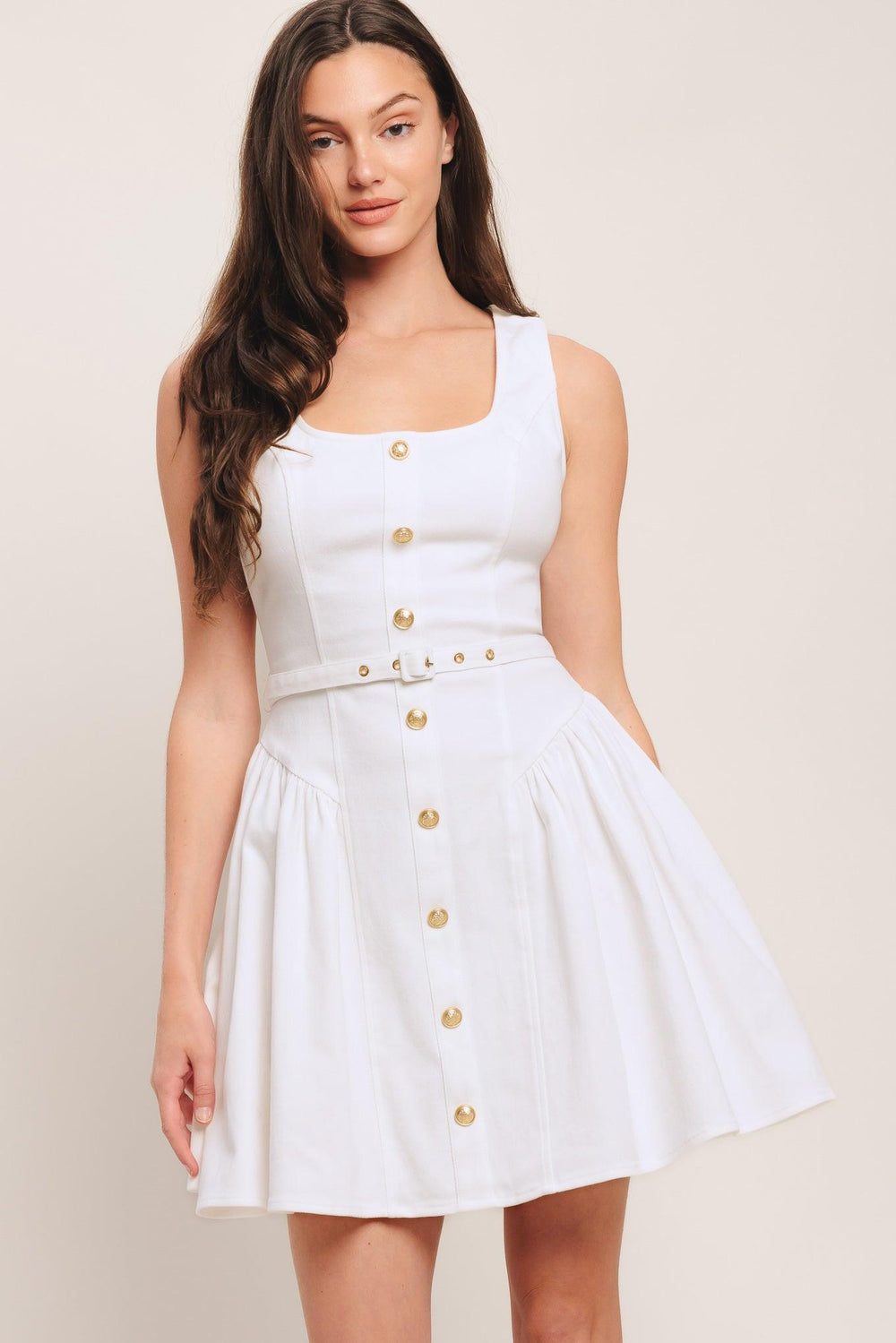 A solid woven mini dress featuring square neckline, sleeveless, front button down detail, self belt, side shirred full skirt and back zipper closure

Details:

Self: 97% Cotton 3% Spandex

Size & Fit

-Model is 5`8" And Wearing Size Small
-Measurements Taken From Size Small
-Approx. Length: 34"
