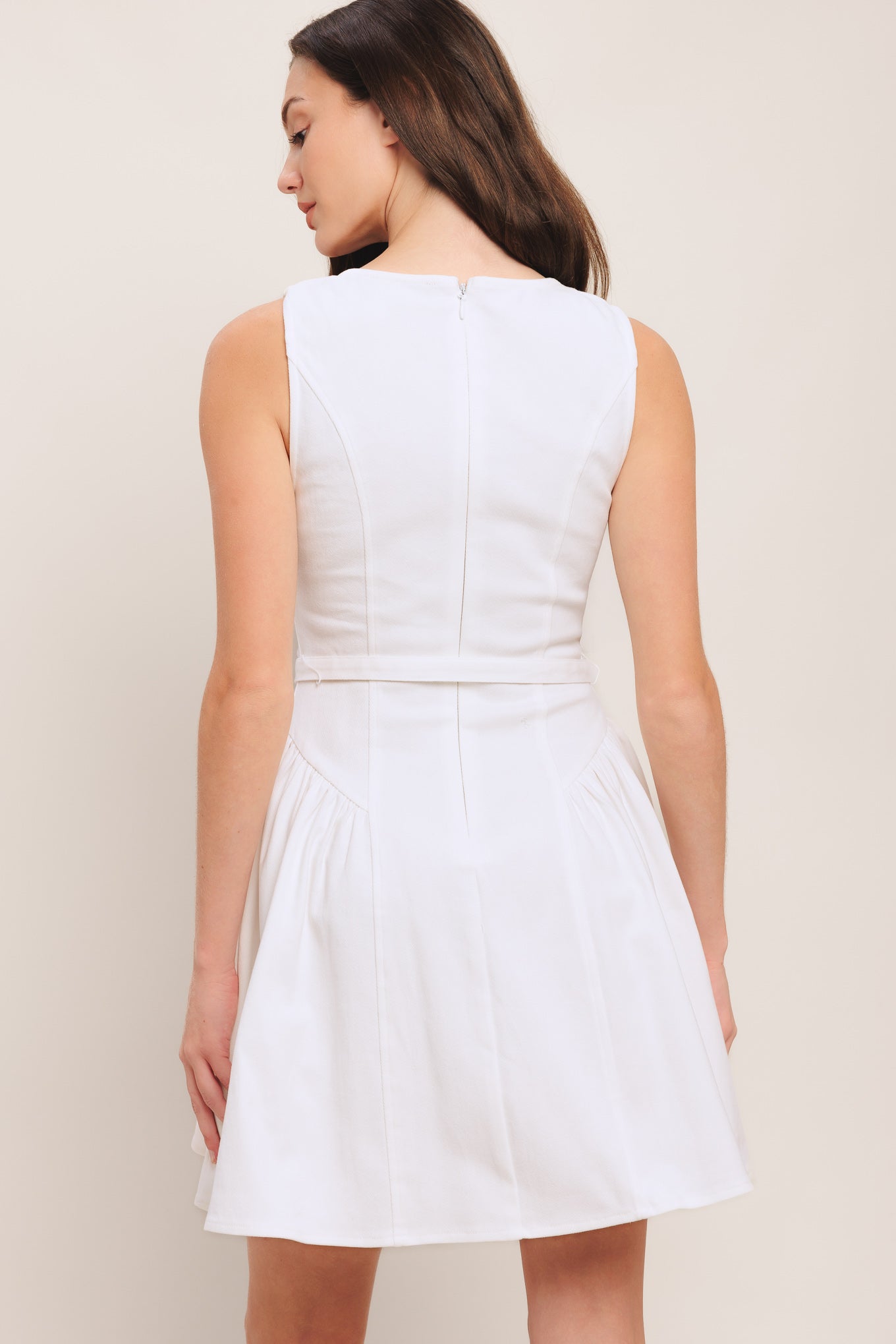A solid woven mini dress featuring square neckline, sleeveless, front button down detail, self belt, side shirred full skirt and back zipper closure

Details:

Self: 97% Cotton 3% Spandex

Size & Fit

-Model is 5`8" And Wearing Size Small
-Measurements Taken From Size Small
-Approx. Length: 34"