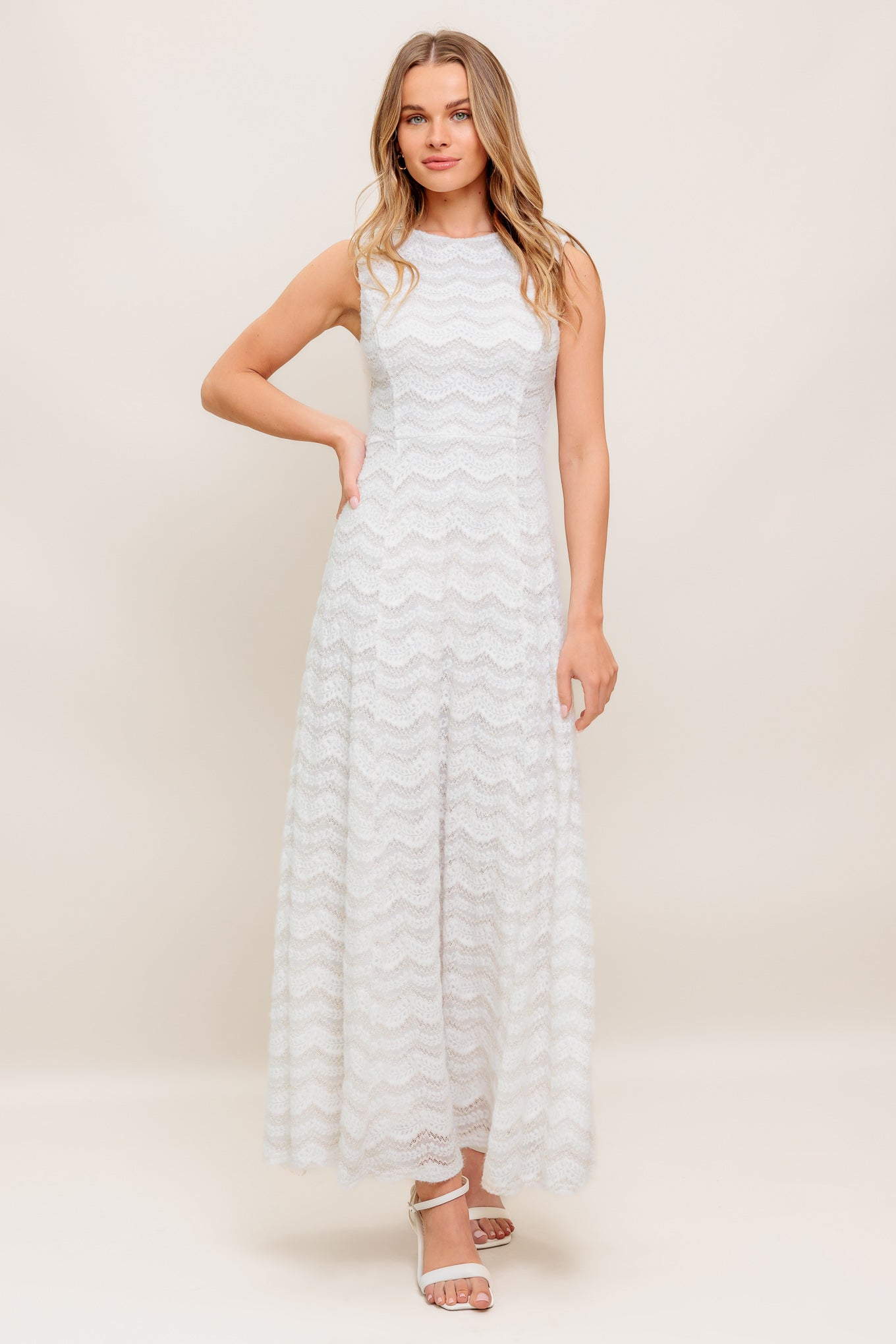 A woven lace ankle dress featuring round neckline, sleeveless, circle skirt and back zipper closure