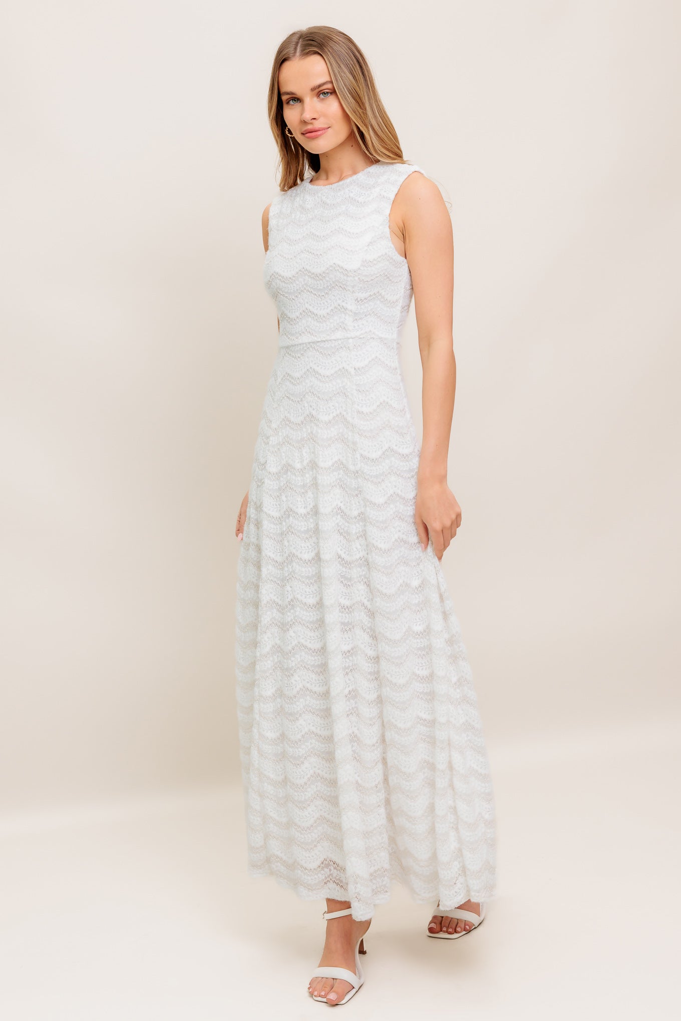 A woven lace ankle dress featuring round neckline, sleeveless, circle skirt and back zipper closure
