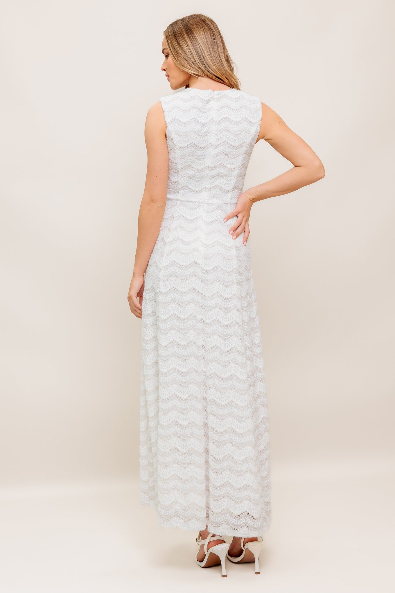 A woven lace ankle dress featuring round neckline, sleeveless, circle skirt and back zipper closure