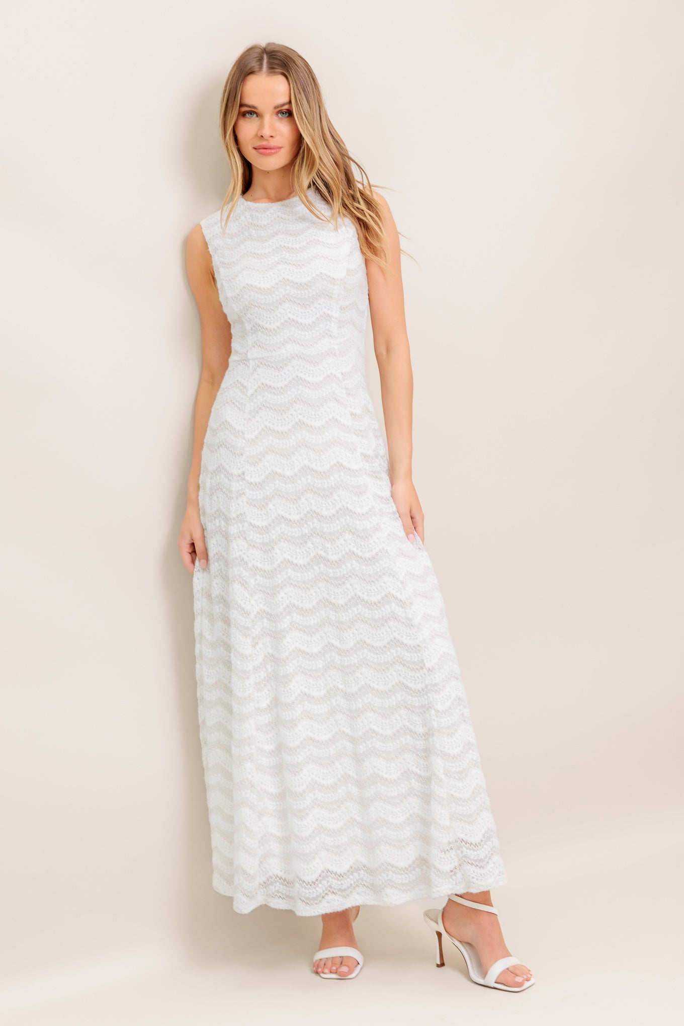 A woven lace ankle dress featuring round neckline, sleeveless, circle skirt and back zipper closure