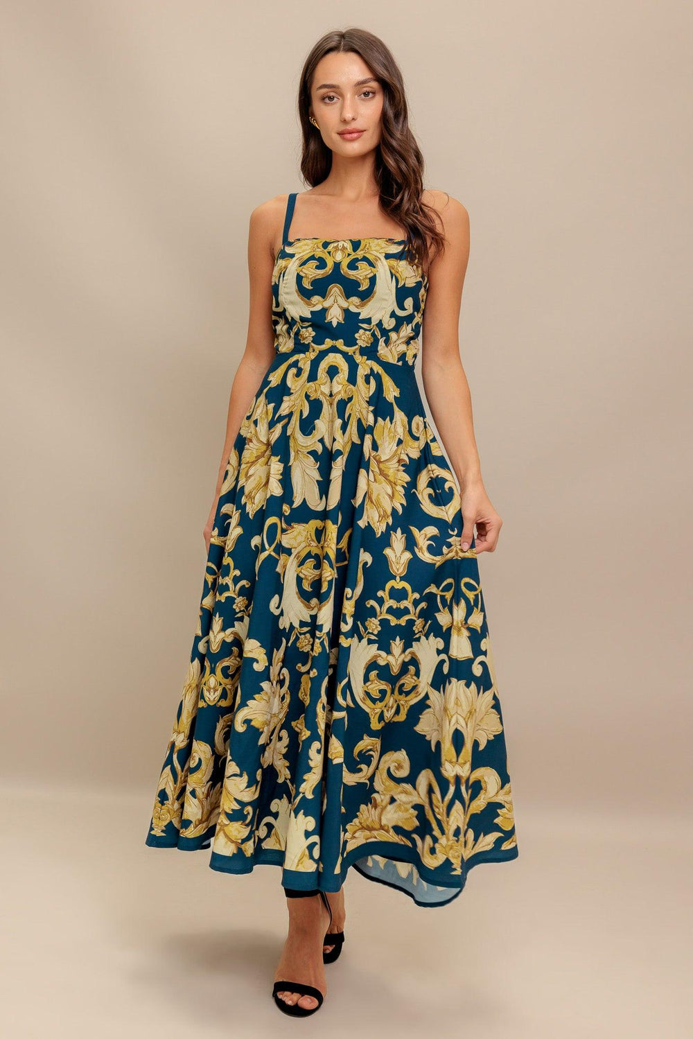 A printed woven midi dress featuring straight neckline, straps, circle skirt and back zipper closure