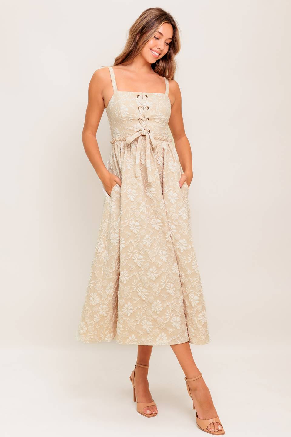 A jacquard woven midi dress featuring straight neckline, straps, front lace up detail, full skirt and smocked back bodice
