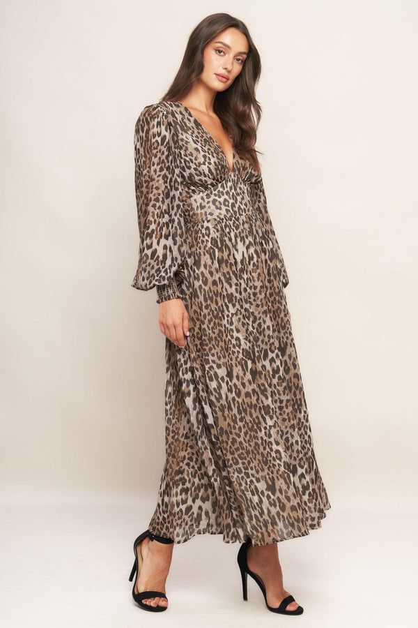 A printed woven midi dress featuring V neckline, long sleeve with smocked cuff, waist yoke and smocked back waist band