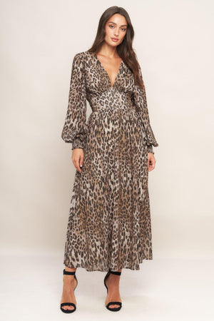 A printed woven midi dress featuring V neckline, long sleeve with smocked cuff, waist yoke and smocked back waist band