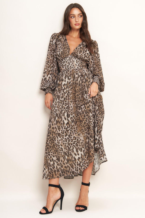 A printed woven midi dress featuring V neckline, long sleeve with smocked cuff, waist yoke and smocked back waist band