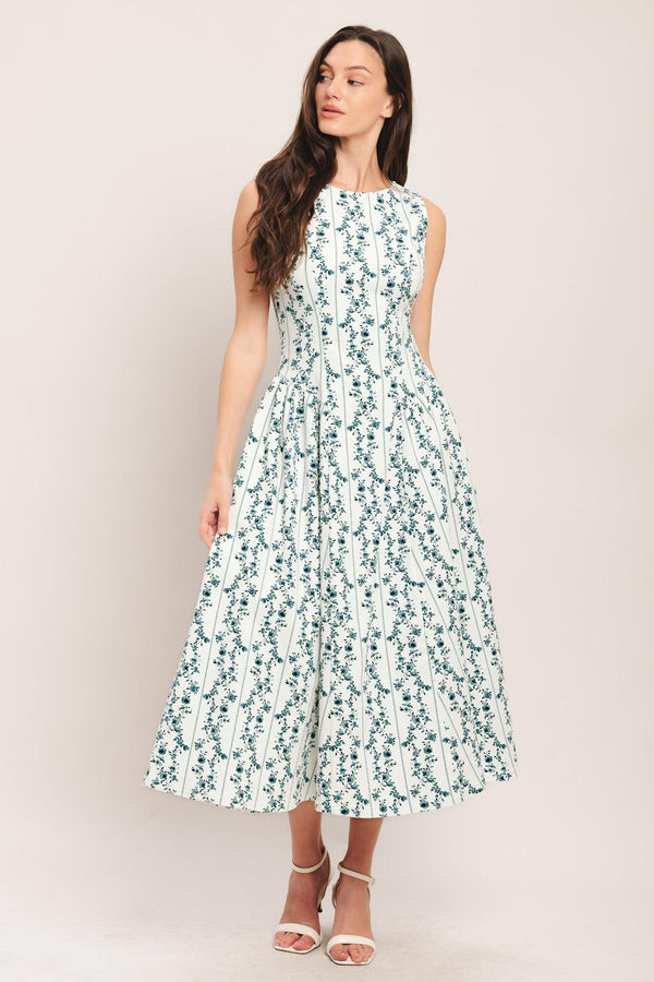 
A printed woven midi dress featuring round neckline, sleeveless, side shirred full skirt and back zipper closure

Details:

Self : 97% Cotton 3% Spandex

Size &amp; Fit

- Model is 5`8" And Wearing Size Small
- Measurements Taken From Size Small
- Approx. Length: 50"