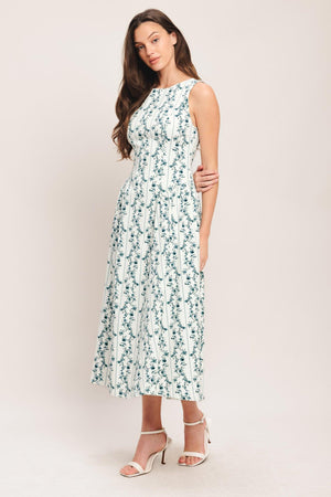 
A printed woven midi dress featuring round neckline, sleeveless, side shirred full skirt and back zipper closure

Details:

Self : 97% Cotton 3% Spandex

Size &amp; Fit

- Model is 5`8" And Wearing Size Small
- Measurements Taken From Size Small
- Approx. Length: 50"