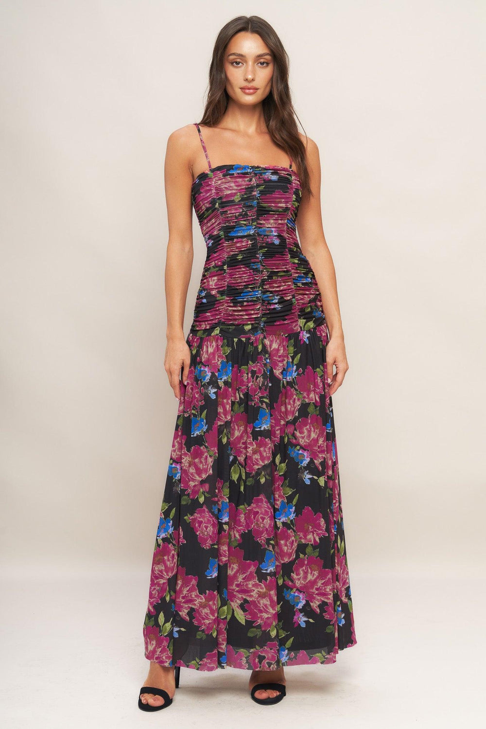 A printed power mesh maxi dress featuring straight neckline, straps, side shirring and back zipper closure