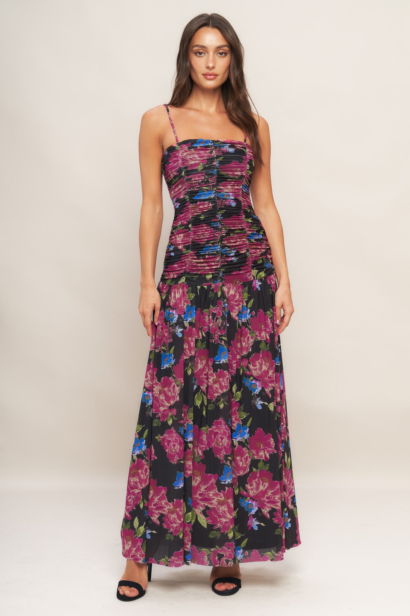 A printed power mesh maxi dress featuring straight neckline, straps, side shirring and back zipper closure
