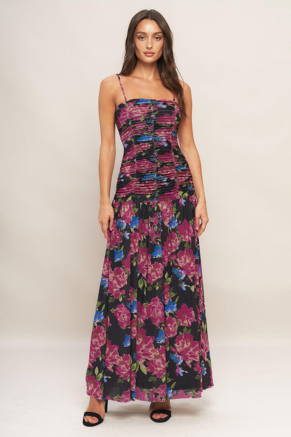 A printed power mesh maxi dress featuring straight neckline, straps, side shirring and back zipper closure
