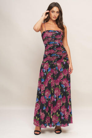 A printed power mesh maxi dress featuring straight neckline, straps, side shirring and back zipper closure