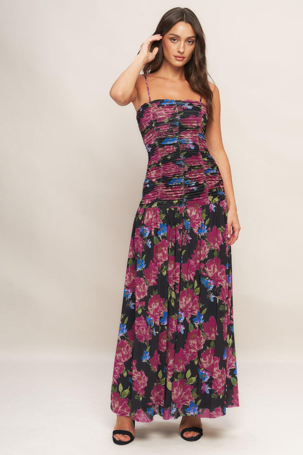 A printed power mesh maxi dress featuring straight neckline, straps, side shirring and back zipper closure