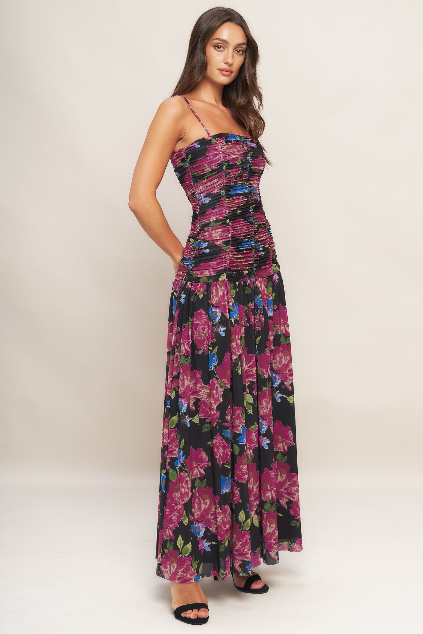 A printed power mesh maxi dress featuring straight neckline, straps, side shirring and back zipper closure