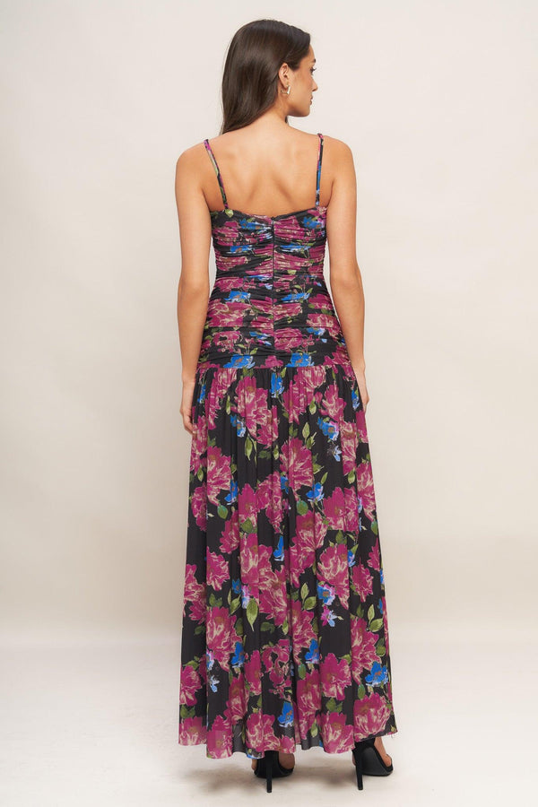 A printed power mesh maxi dress featuring straight neckline, straps, side shirring and back zipper closure